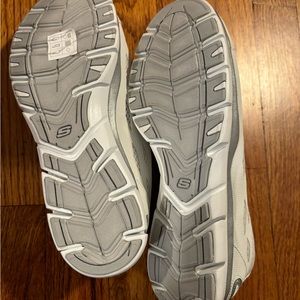 Going places: Sketchers white slip on sneakers size 8.5